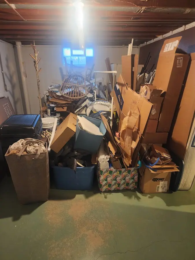 Roll-off dumpster container at job site for 2 Yard Dumpster Rental in Garden City